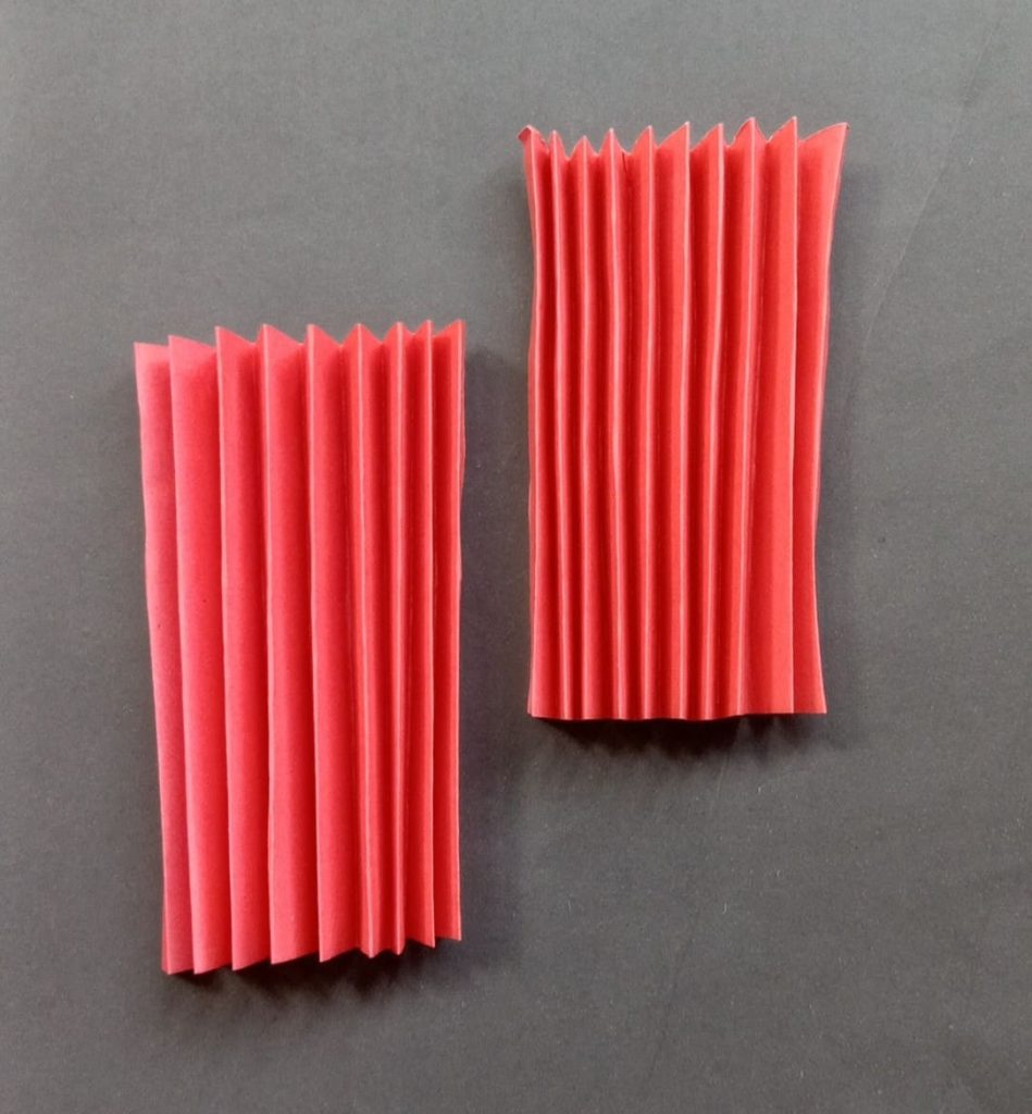 fold the paper back and forth to make the angle's body